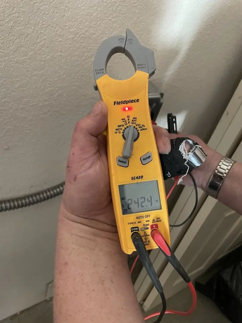 Voltage testing with clamp meter during Generator Installation in Camp Pendleton Mainside